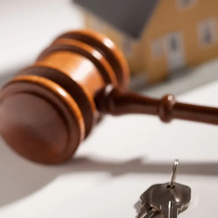 Property auction gavel with house and keys